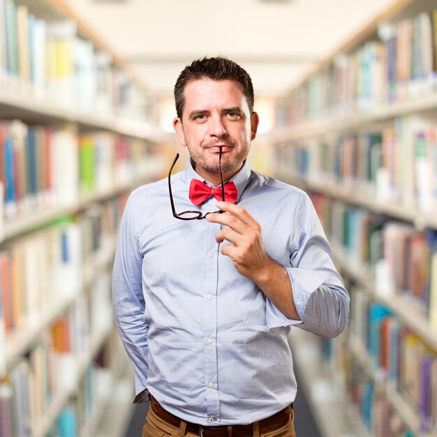 Man wearing a red bow tie. Looking sexy.