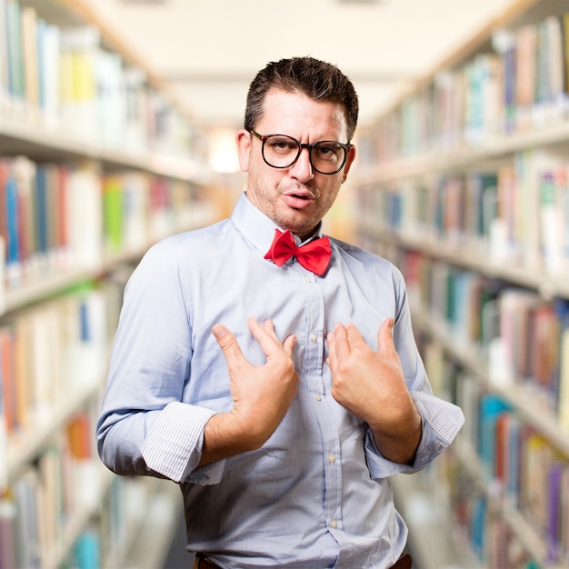 Man wearing a red bow tie. Looking surprised.