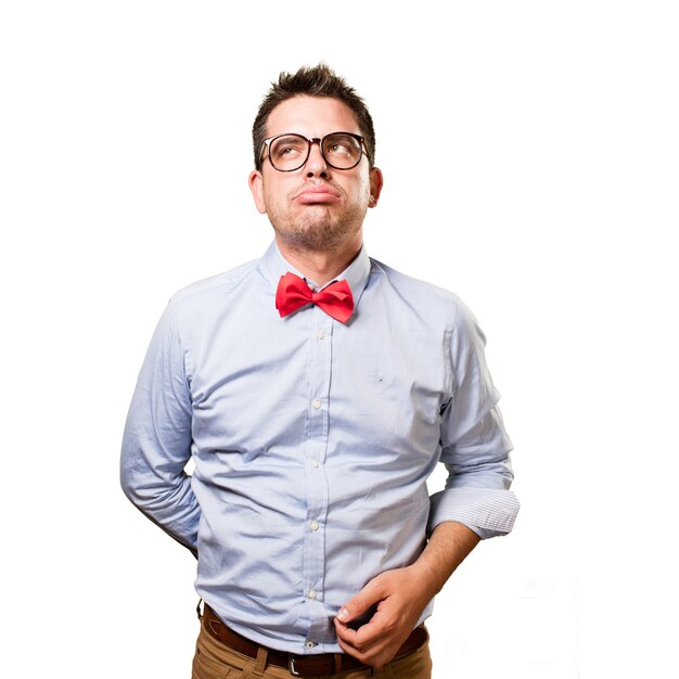 Man wearing a red bow tie. Looking tired.