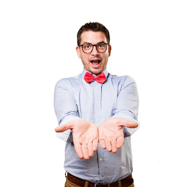 Man wearing a red bow tie. Offering something.