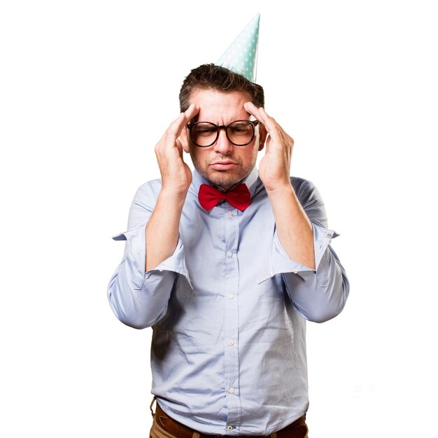 Free photo man wearing a red bow tie and party hat. looking in a deep think