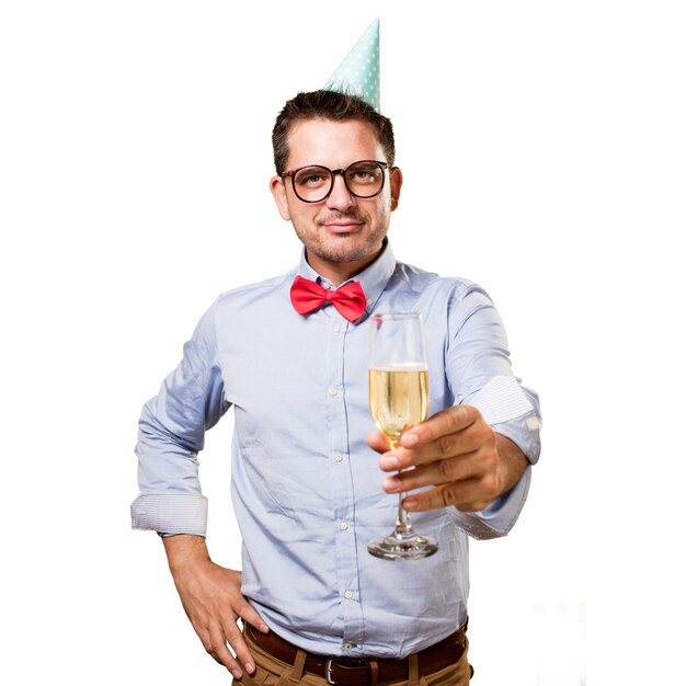 Man wearing a red bow tie and party hat. Offering a champagne gl