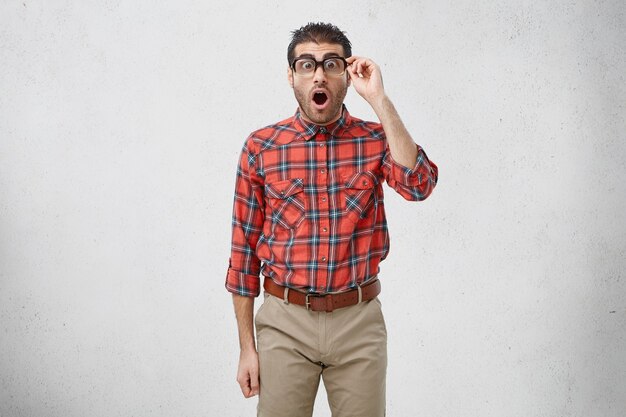 Man wearing striped shirt and eyeglasses