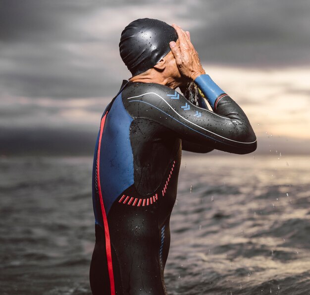 Man wearing swimming cap medium shot