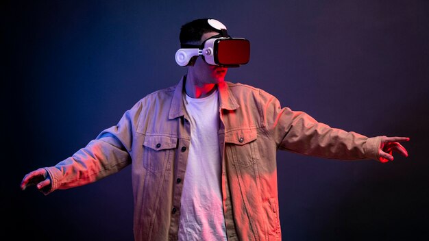 Free photo man wearing vr goggles for gaming