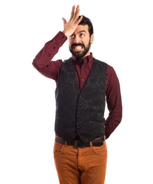 Man wearing waistcoat having doubts