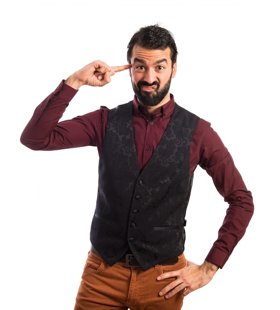 Man wearing waistcoat making crazy gesture