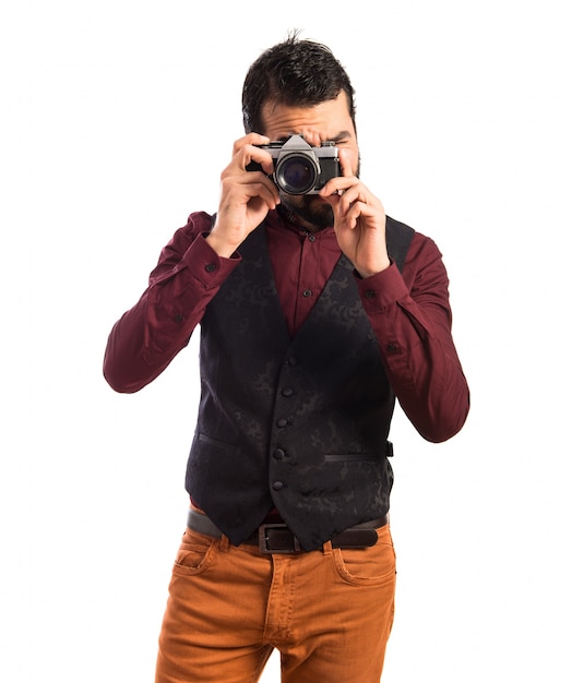 Man wearing waistcoat photographing