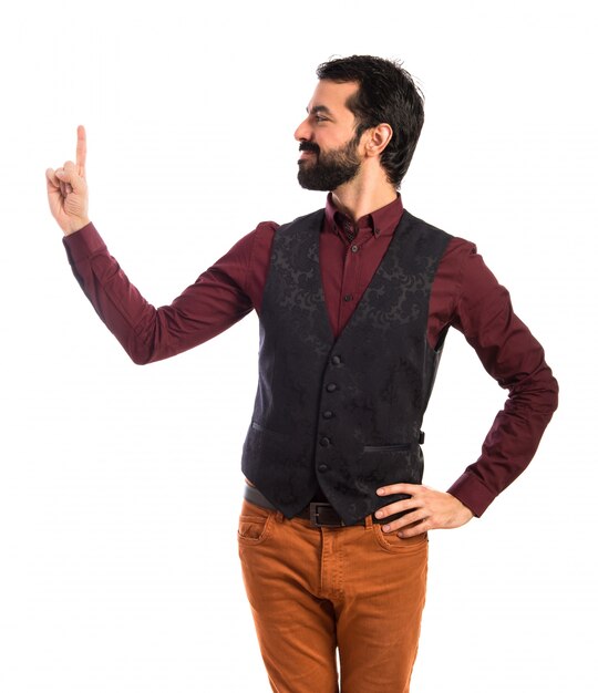 Man wearing waistcoat pointing up