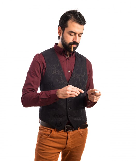 Man wearing waistcoat smoking