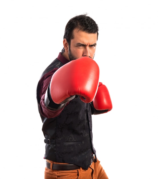 Man wearing waistcoat with boxing gloves