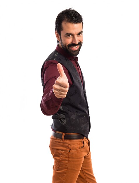 Man wearing waistcoat with thumb up