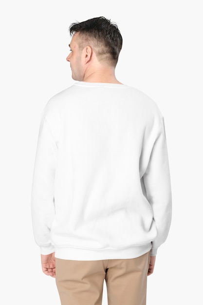 Man wearing white sweater close-up, rear view