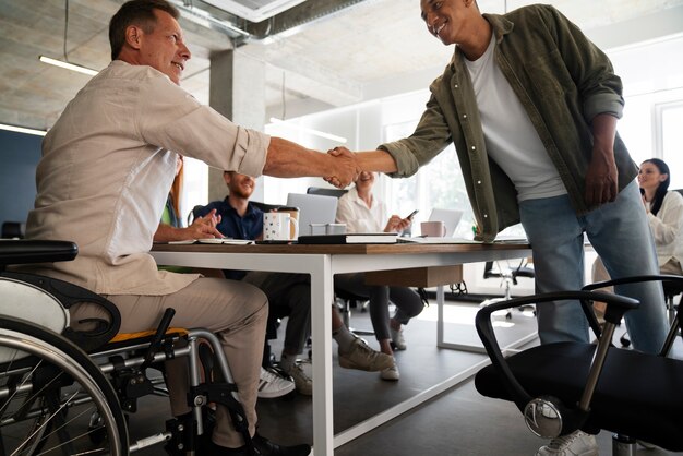 Man in a wheelchair having an inclusive office job