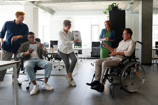 Man in a wheelchair having an inclusive office job