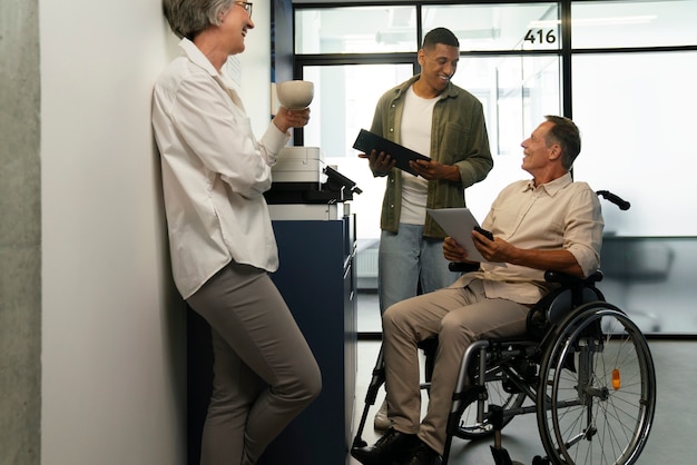 Man in a wheelchair having an office job