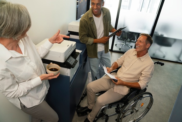 Man in a wheelchair having an office job