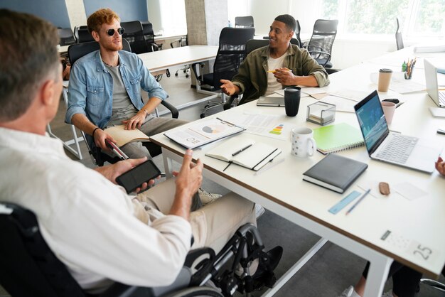 Man in a wheelchair having an office job