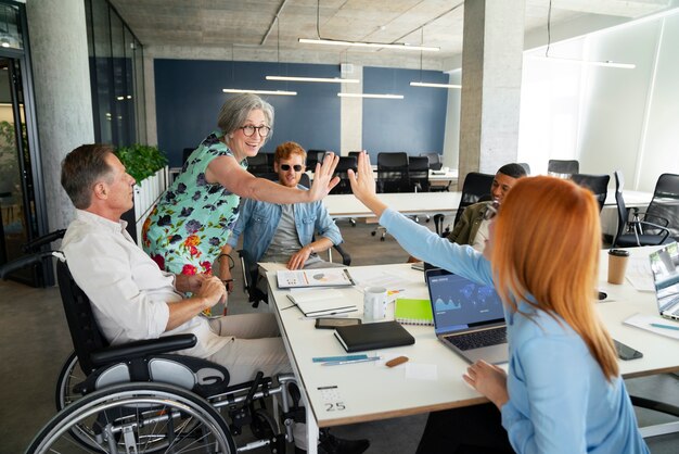 Man in a wheelchair having an office job