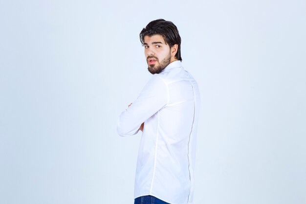 Man in a white shirt giving neutral poses