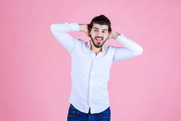 Man in a white shirt giving smiling and positive poses.