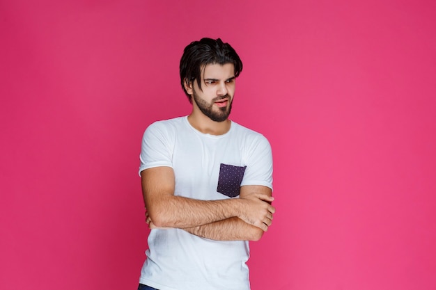 Man in white shirt looks confused and lost.