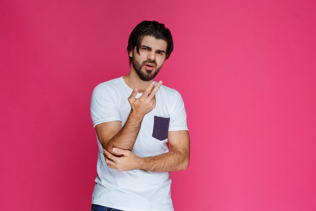 Man in white shirt looks confused and lost.