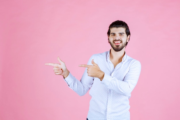 Man in a white shirt showing the left side with emotions.