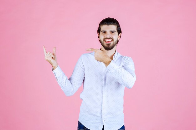 Man in a white shirt showing the left side with emotions.