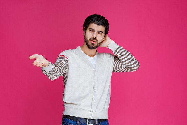 Man in white shirt showing that he has no idea about the topic. 