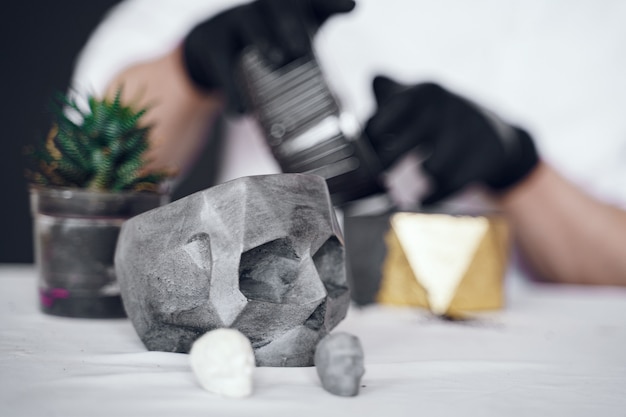 Man in a white shirt works with a cement