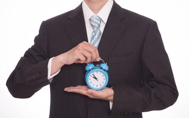 Man with a alarm clock in his hands