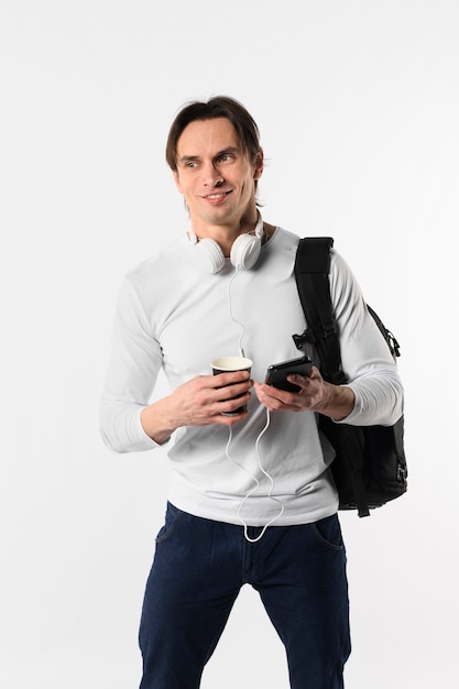 Man with backpack and mobile