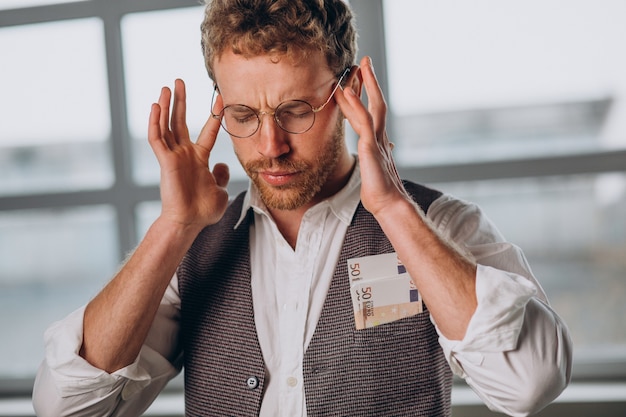 Man with banknotes isolated in studio