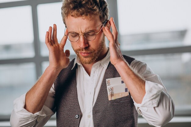 Man with banknotes isolated in studio