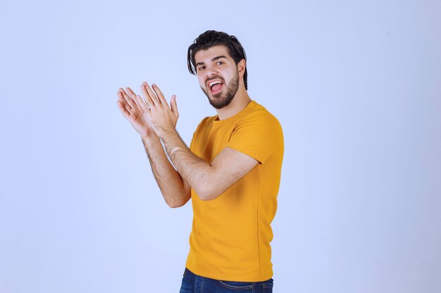 Man with beard applauding something