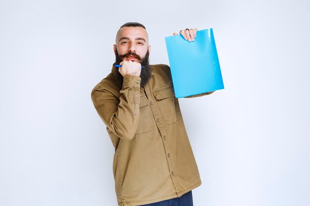 Man with beard demonstrating his project and waiting for reviews.  