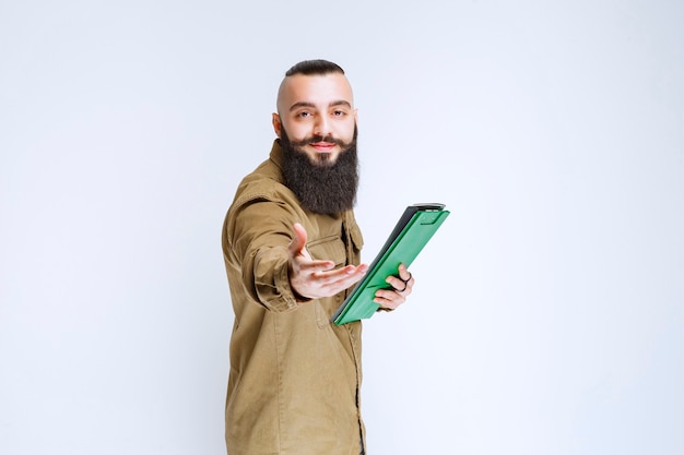 Man with beard giving his project list for verification. 