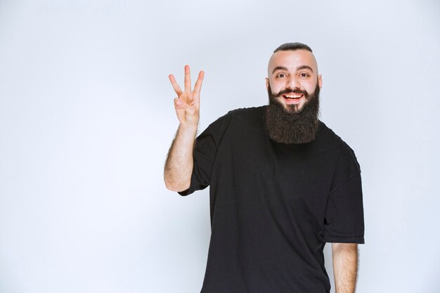 Man with beard greeting his friends. 