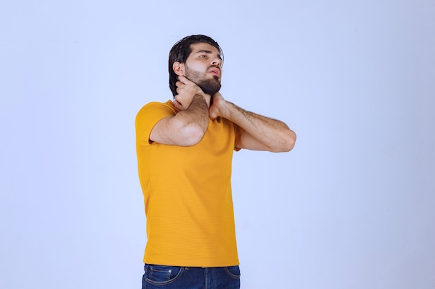 Man with beard has headache and feels sick