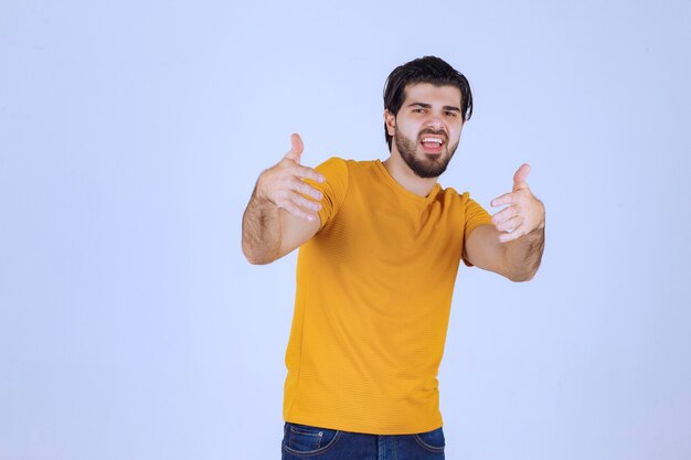 Man with beard showing thumb up sign