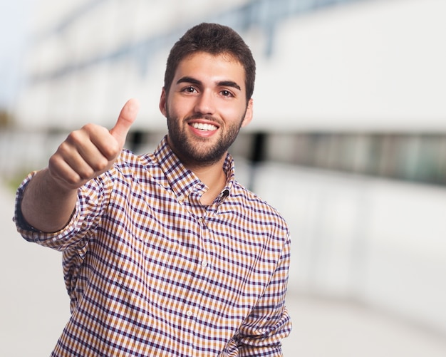 Man with beard showing thumb up. 