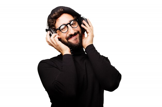 Man with a beret listening to music over headphones