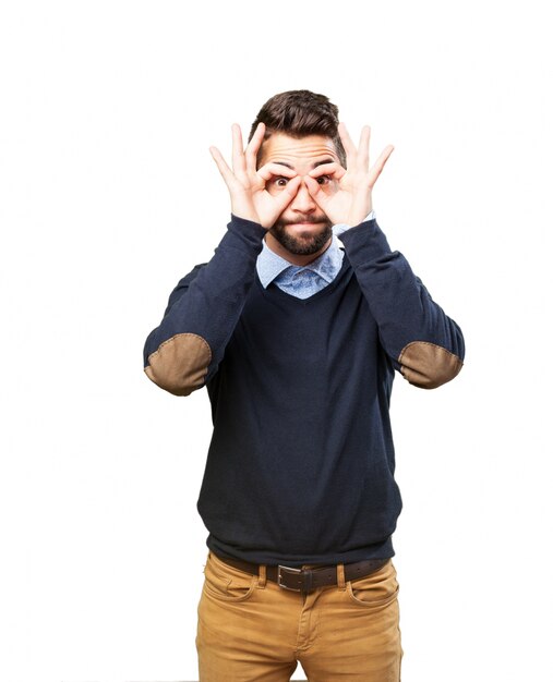 Man with binoculars made with their hands