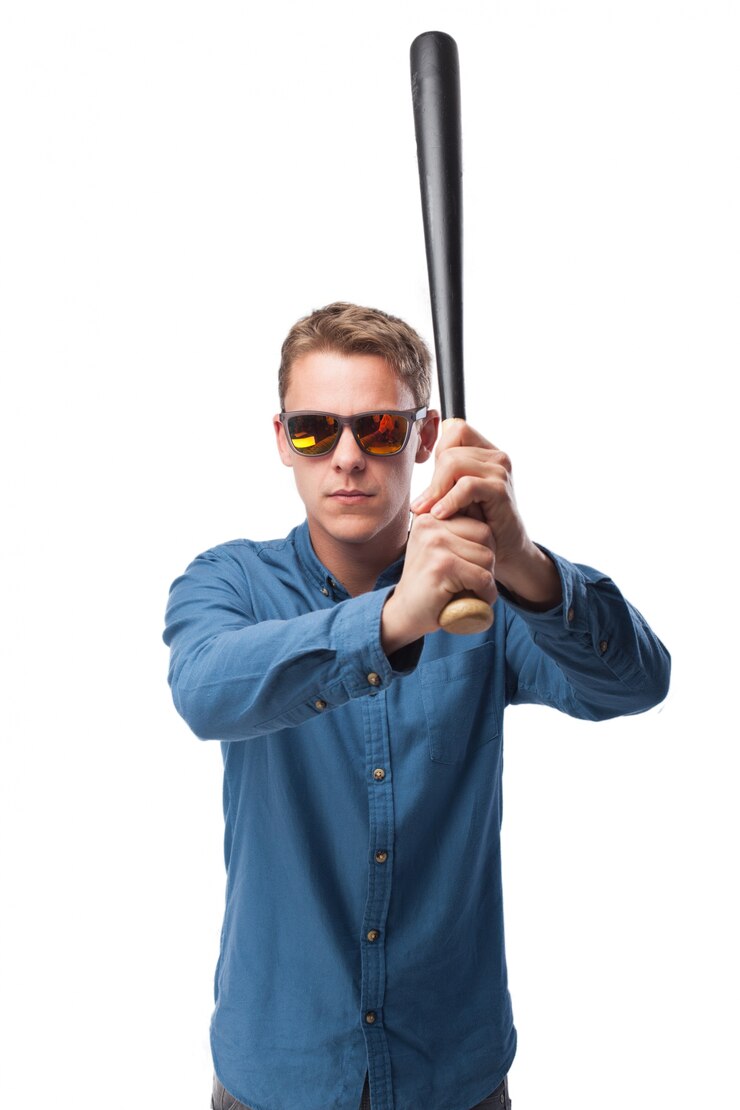 Free Photo man with a black baseball bat