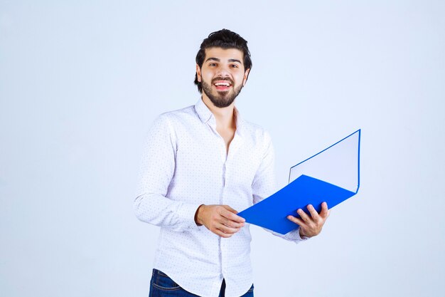 Man with a blue folder feels successful