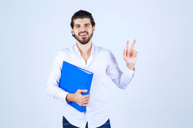 Man with a blue folder feels successful