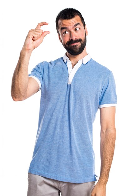 Man with blue shirt doing tiny sign