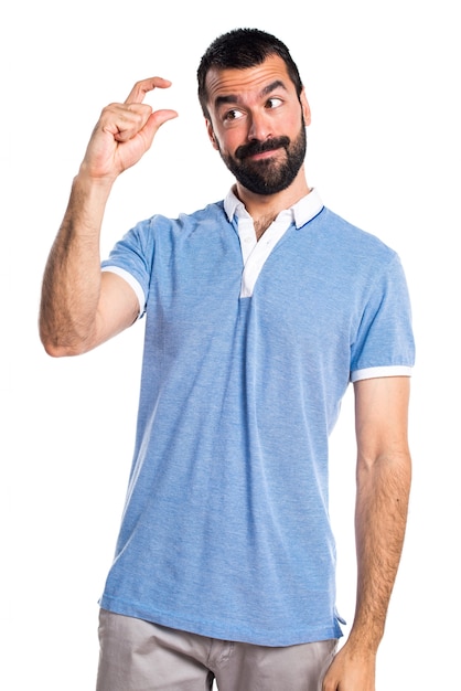 Man with blue shirt doing tiny sign