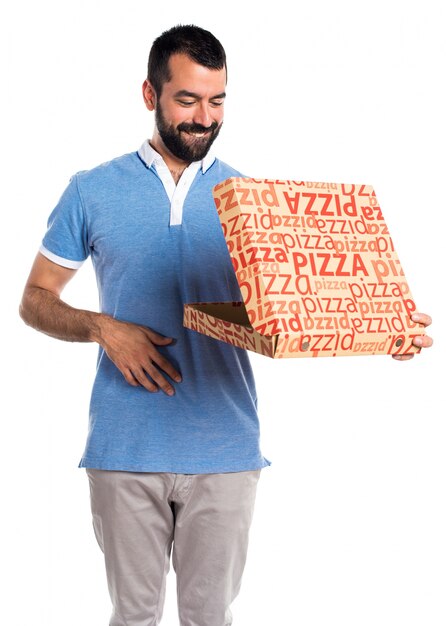 Man with blue shirt  holding a pizza box